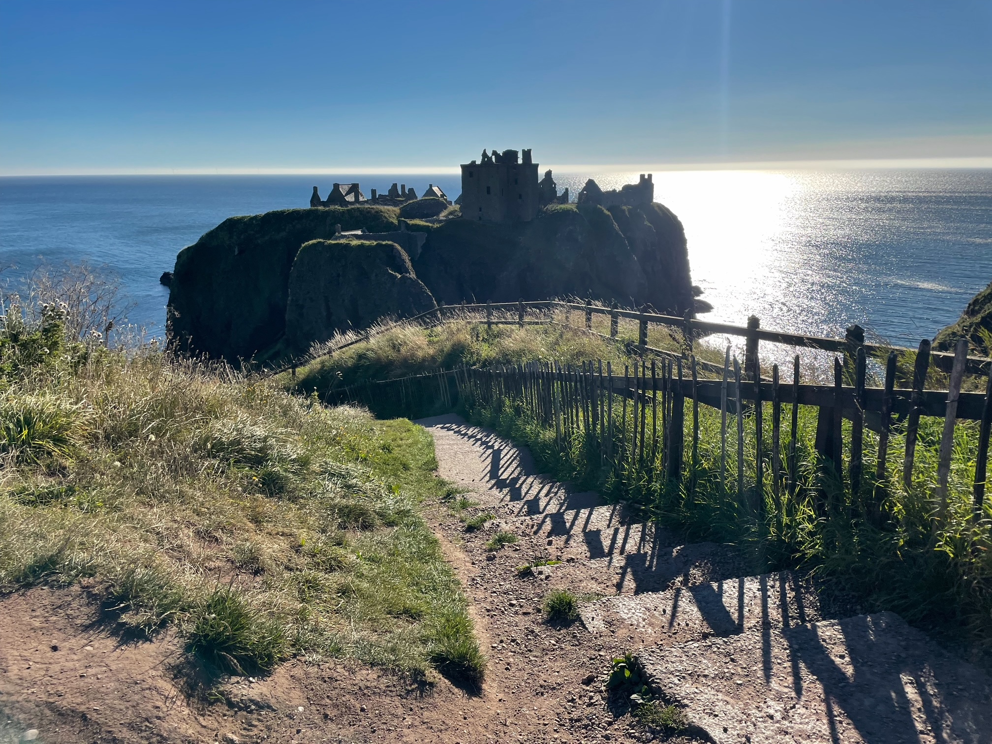 Dunnottar Castle, is a medieval fortress, perched atop a cliff overlooking the North Sea. Although it's now a ruin, it's location makes it highly photogenic.