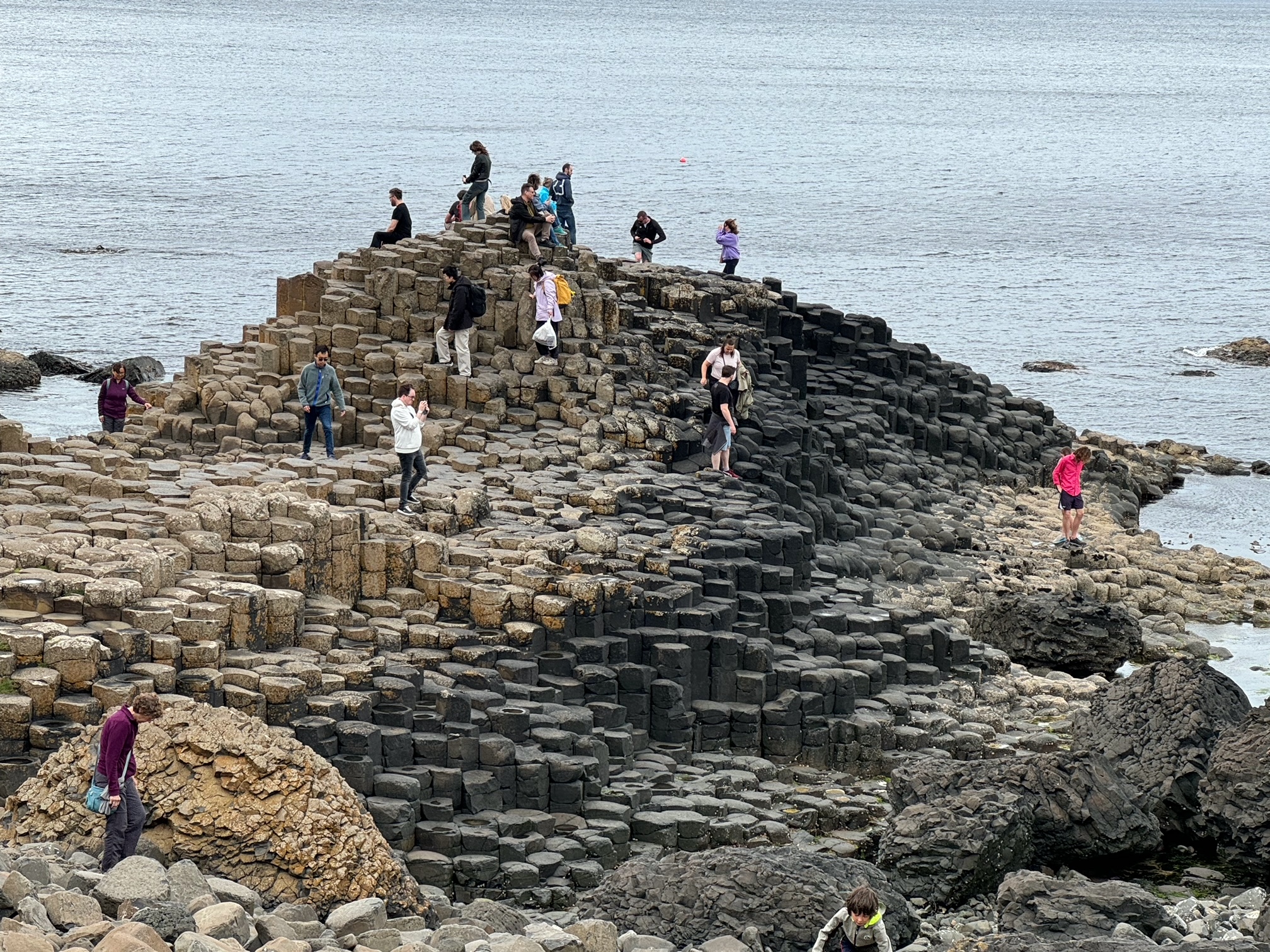 Giant's Causeway is a geological phenomenon of 40,000 interlocking basalt columns formed by an ancient volcanic eruption.